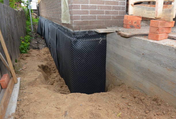 SJ Waterproofing Pros technician performing targeted Waterproofing assessment in Basom, NY